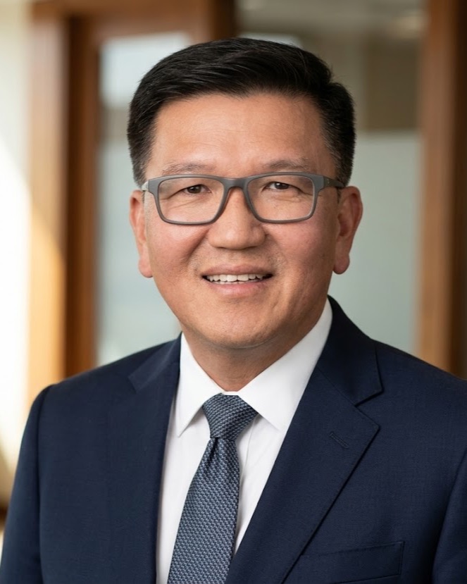 Ray Lay, founder of MONTAGNO GP — a composed businessman in a navy suit and tie.